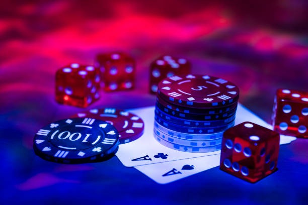 Live dealer revealing baccarat cards on table with video feed streamed to phone